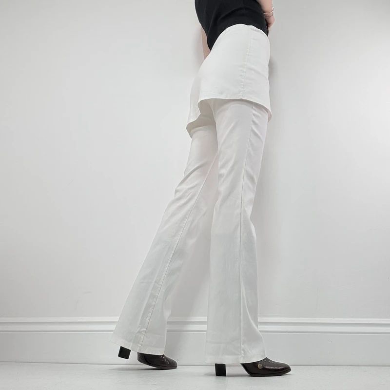 Layered flared trousers with mini skirt overlay