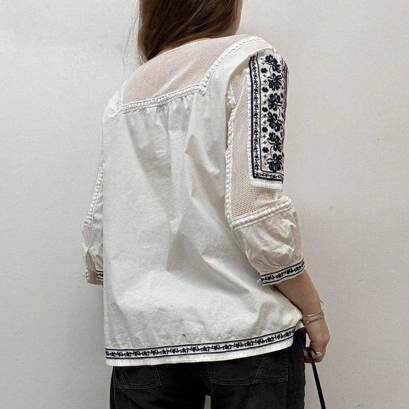 white crochet shirt with navy embroidery