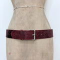 Distressed burgundy red leather belt