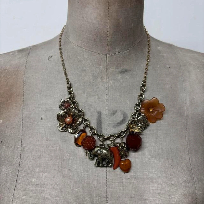 Gold flower elephant charm necklace