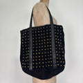 Black suede tote bag with gold studded spikes