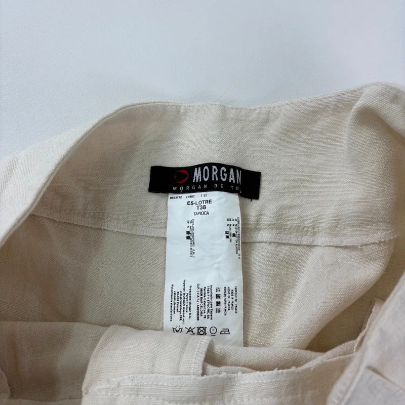 white flared wide leg thick waistband trousers