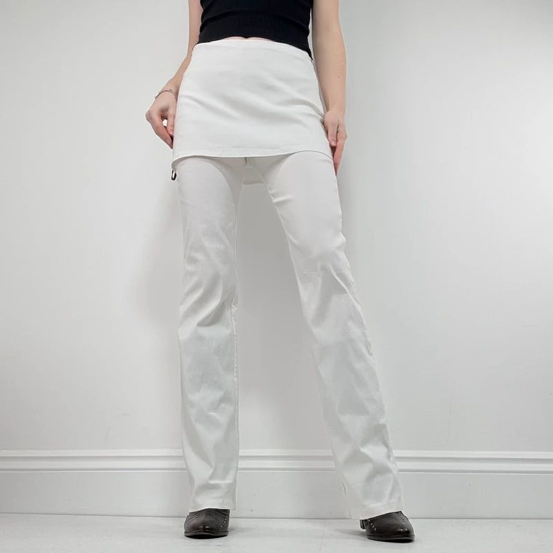 Layered flared trousers with mini skirt overlay