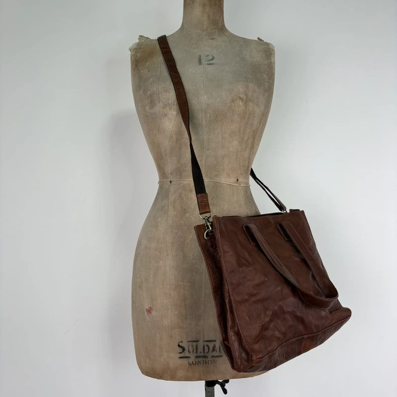 Distressed vintage brown leather handbag