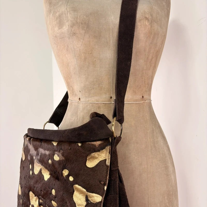 Brown cow hide leather satchel bag with gold embellishment