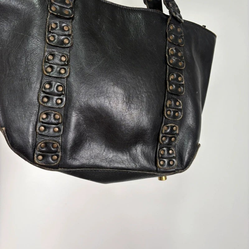 Black mini handbag with studded patchwork handle.