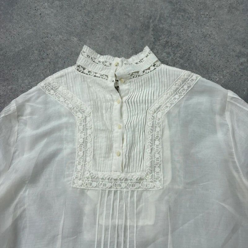 white pleated lace blouse