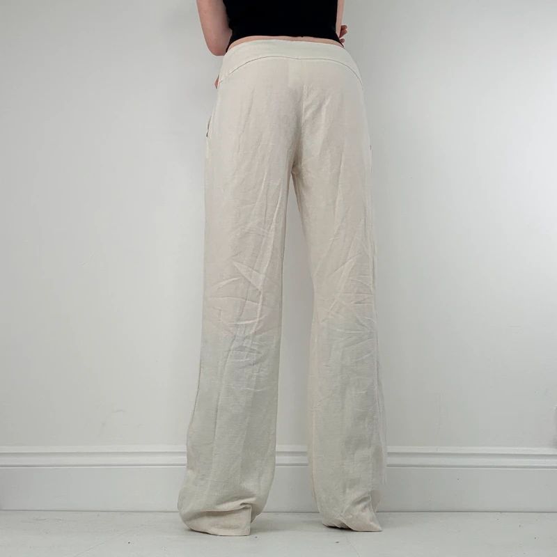white flared wide leg thick waistband trousers