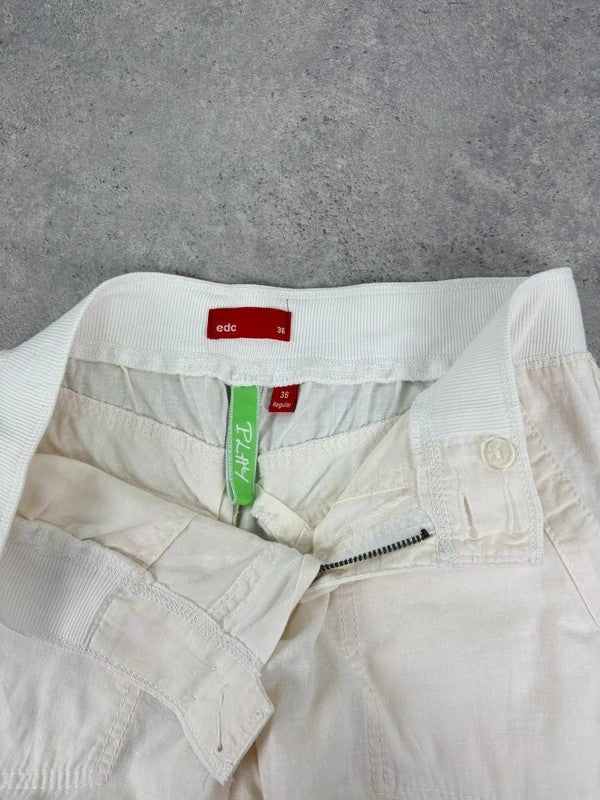 White low rise wide leg flared linen trousers