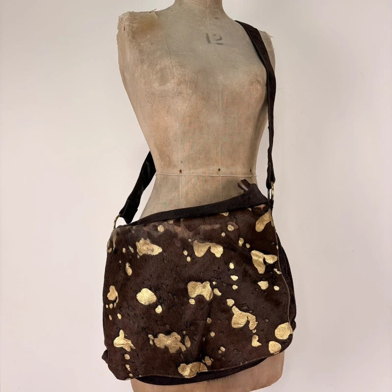 Brown cow hide leather satchel bag with gold embellishment