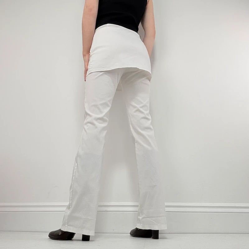 Layered flared trousers with mini skirt overlay