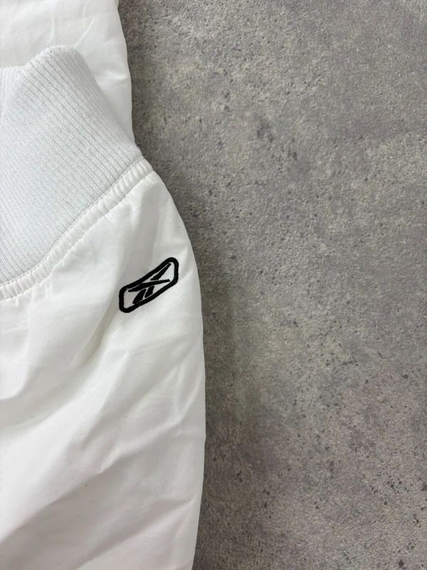 low rise white Reebok tracksuit bottoms