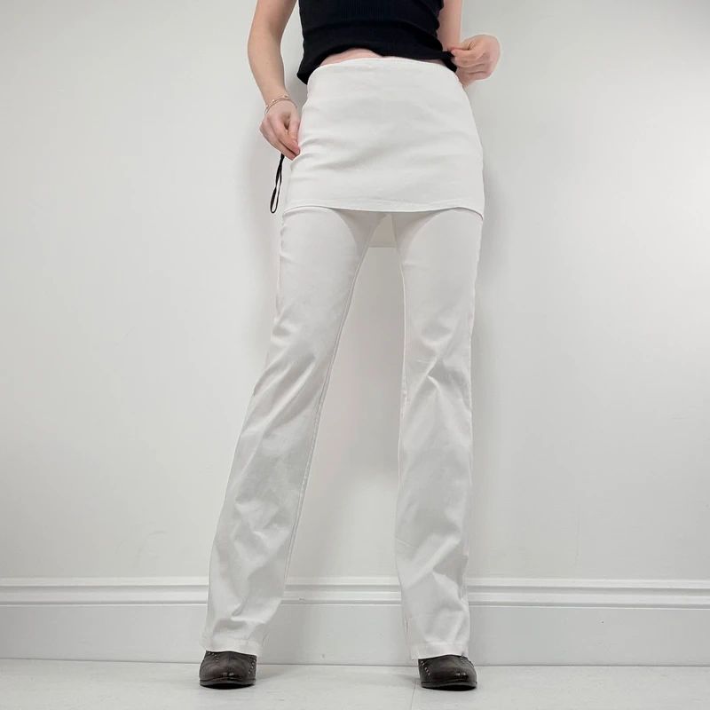 Layered flared trousers with mini skirt overlay