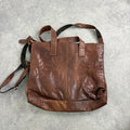 Distressed vintage brown leather handbag