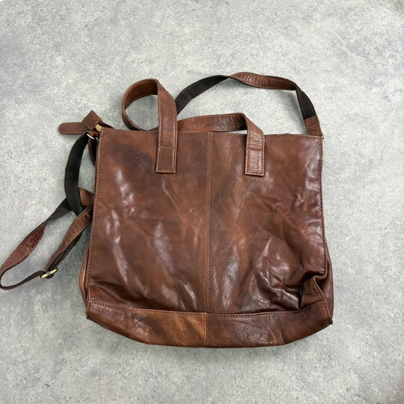 Distressed vintage brown leather handbag