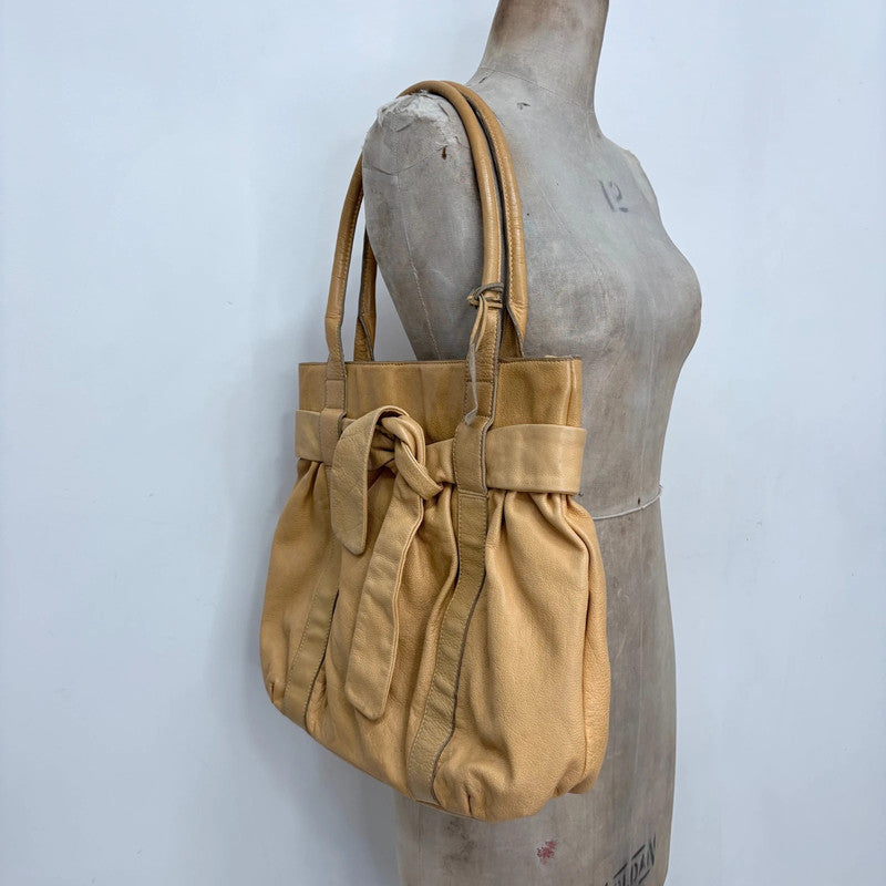 tan leather slouchy bow shoulder bag