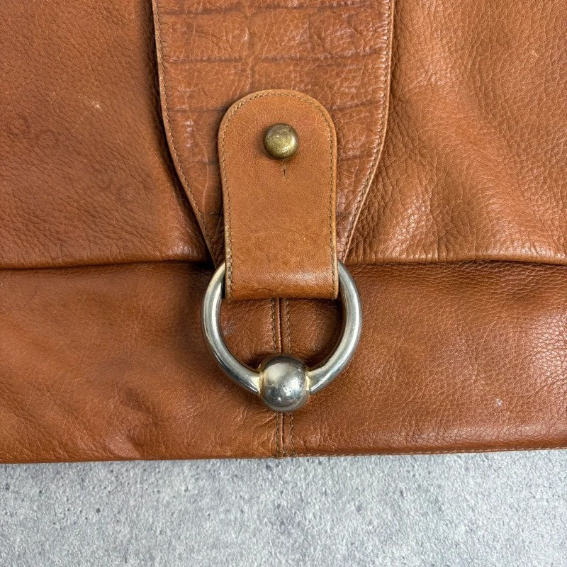 tan lather piercing punky silver hardware clutch bag