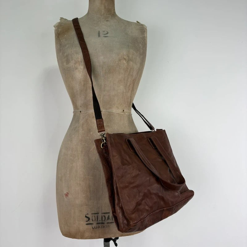 Distressed vintage brown leather handbag