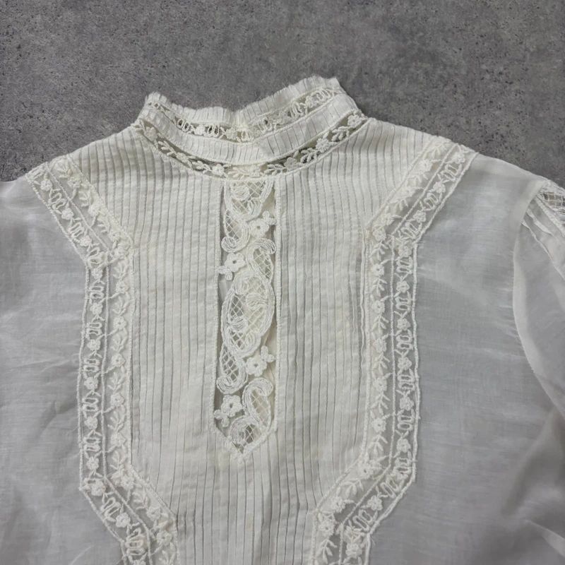 white pleated lace blouse