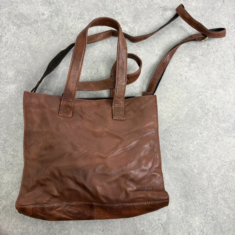 Distressed vintage brown leather handbag
