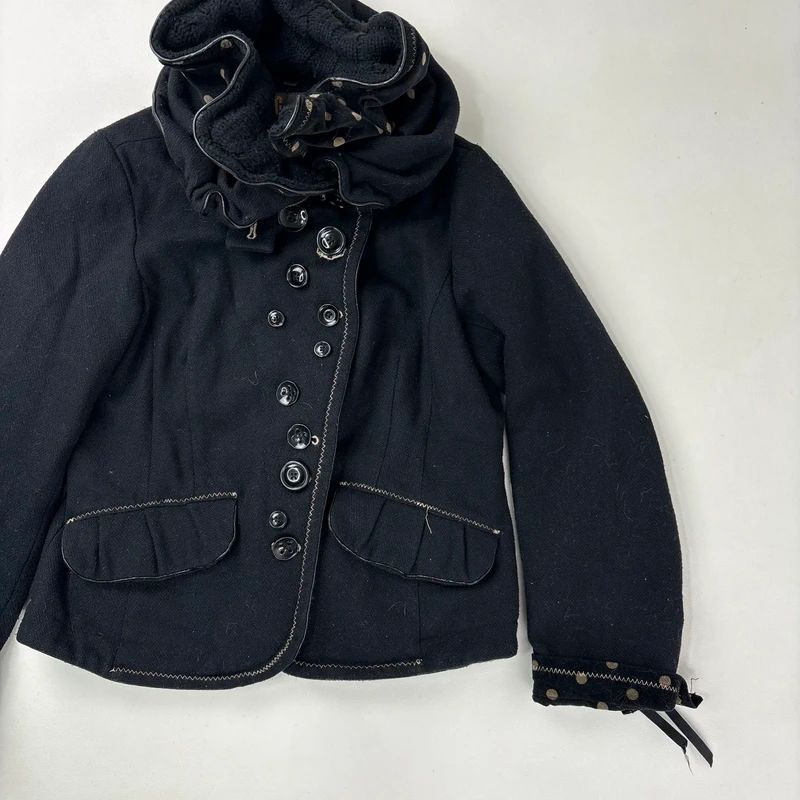 black structured asymmetric polkadot coat