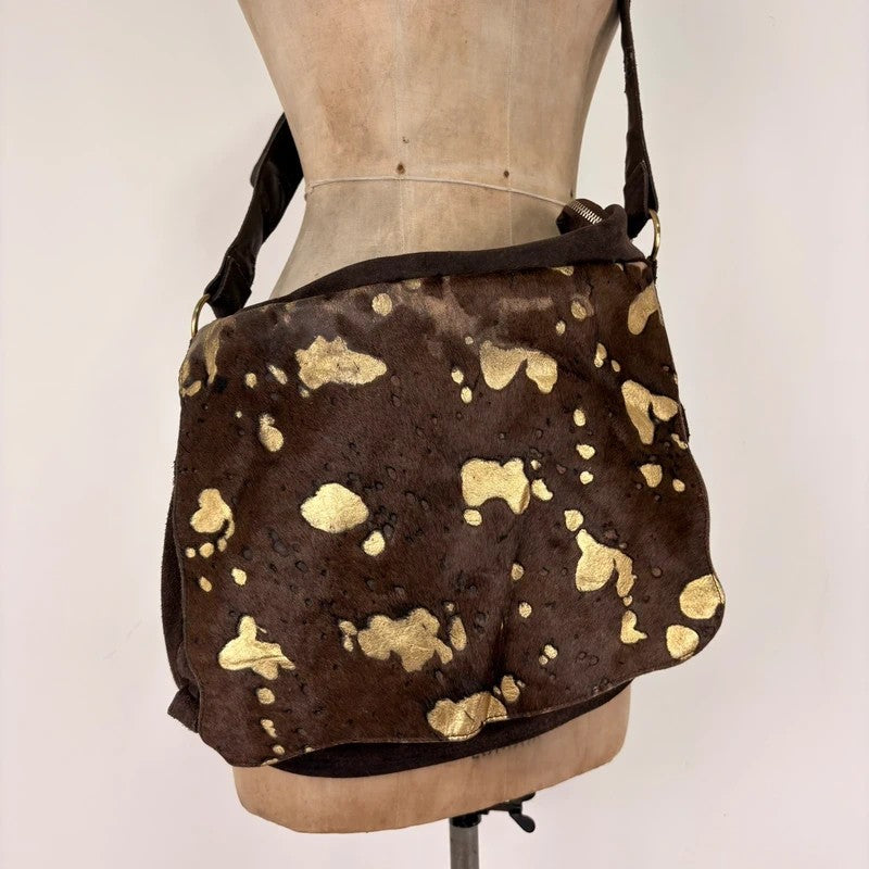 Brown cow hide leather satchel bag with gold embellishment