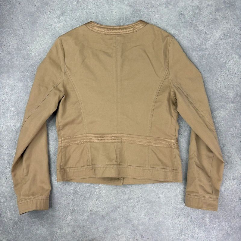 tan boxy cropped fit jacket with exposed button detail