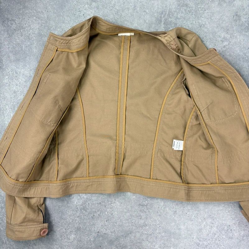 tan boxy cropped fit jacket with exposed button detail