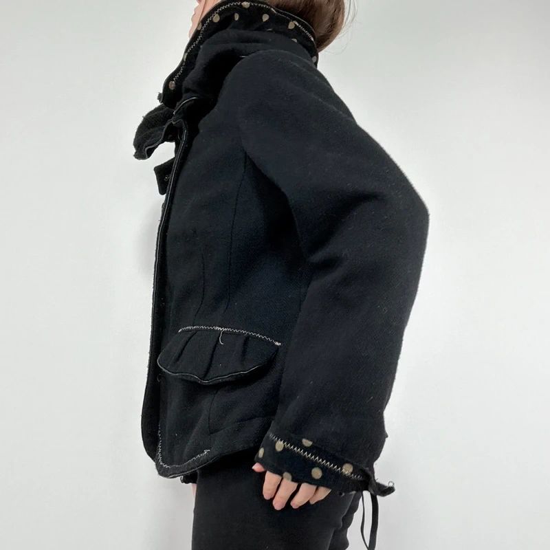 black structured asymmetric polkadot coat