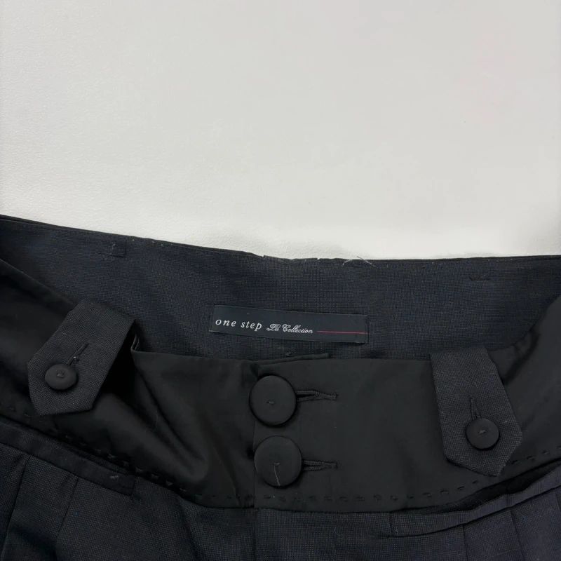 pleated black tailored trousers