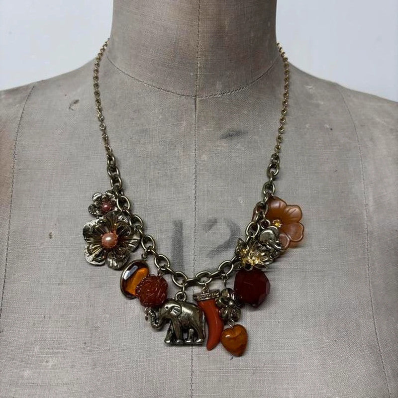 Gold flower elephant charm necklace