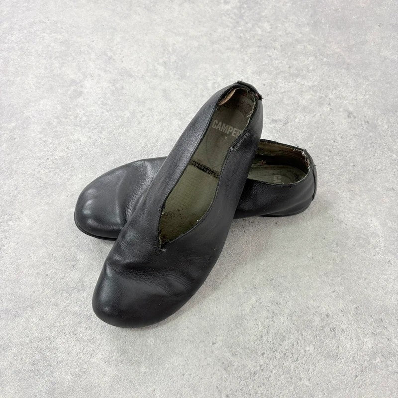 Black leather camper ballet flats