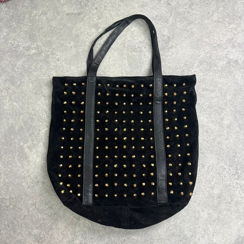 Black suede tote bag with gold studded spikes