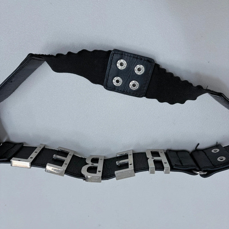 black faux leather silver spellout belt