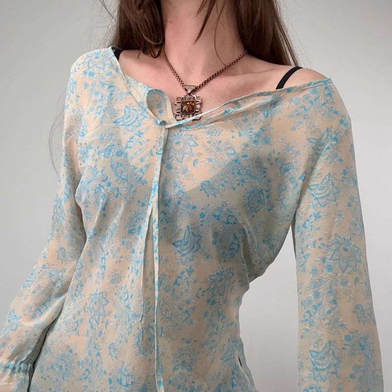 sheer floral flutter ETAM blouse with flare cuffs