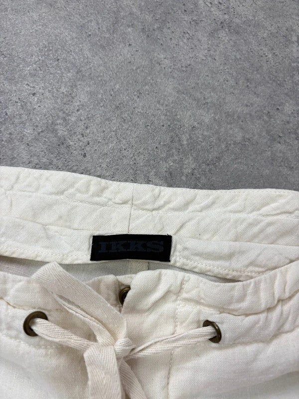 white linen flared utility button trousers