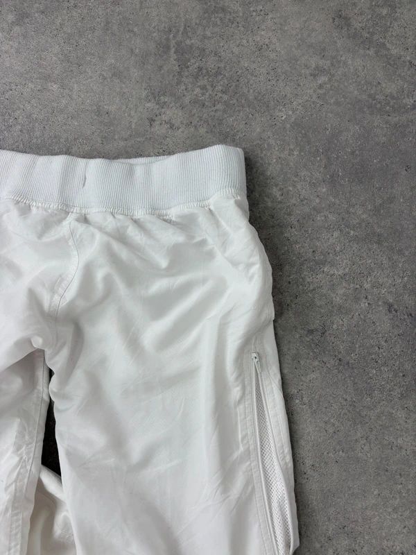 low rise white Reebok tracksuit bottoms