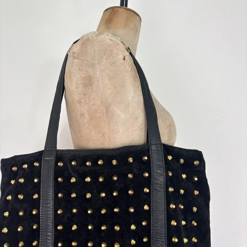 Black suede tote bag with gold studded spikes