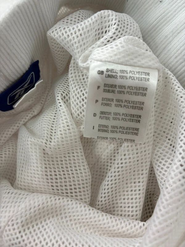 low rise white Reebok tracksuit bottoms