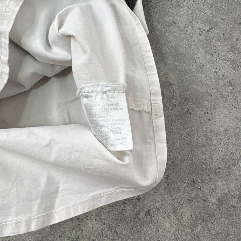 flared white shirt layered long sleeve top