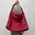 red leather slouchy woven bag