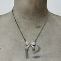 Silver bow necklace