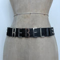 black faux leather silver spellout belt