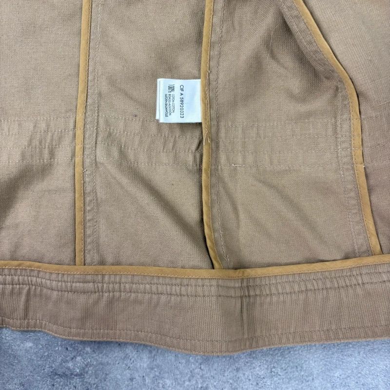 tan boxy cropped fit jacket with exposed button detail