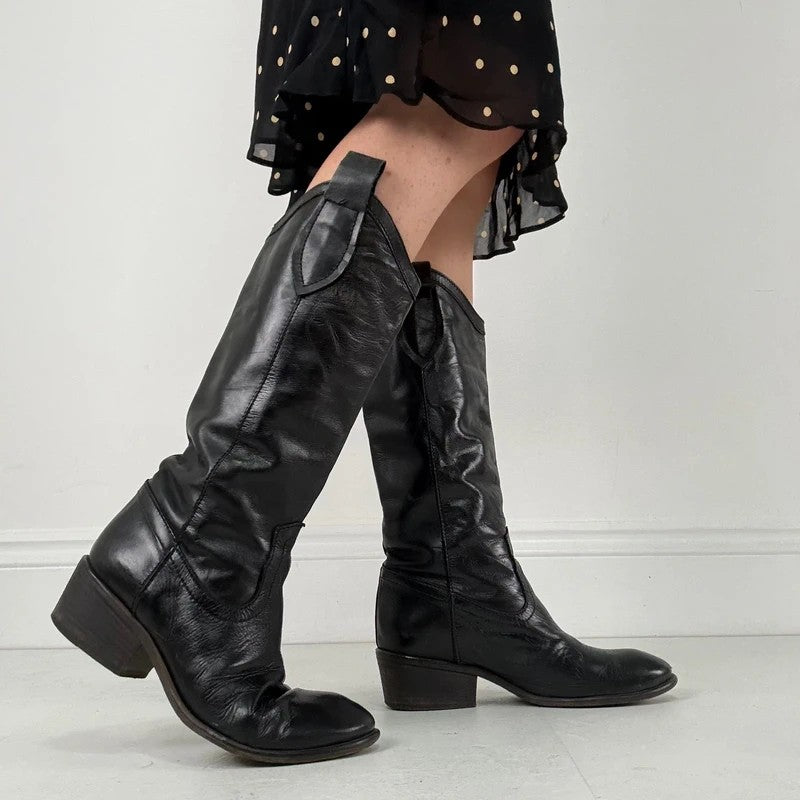 Black leather pointed toe boots