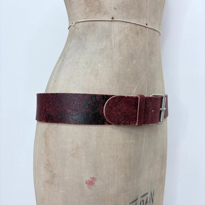 Distressed burgundy red leather belt