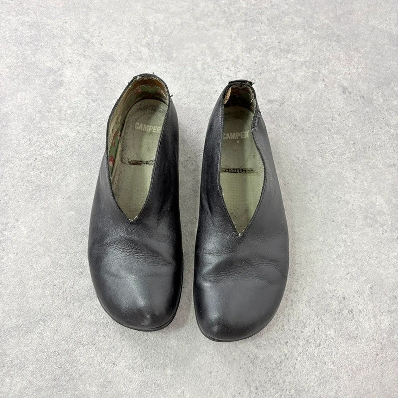 Black leather camper ballet flats