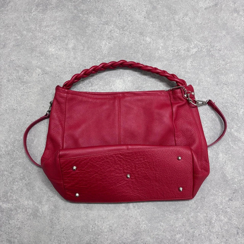 red leather slouchy woven bag